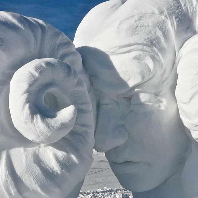 Banging heads together snow sculpture
